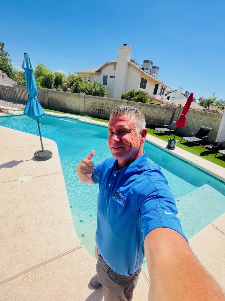 Allen poolside after a service visit, thumbs up