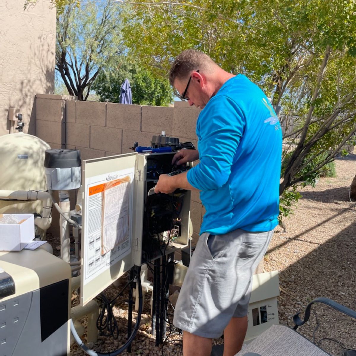 Allen's Pool Catering tech servicing pool equipment