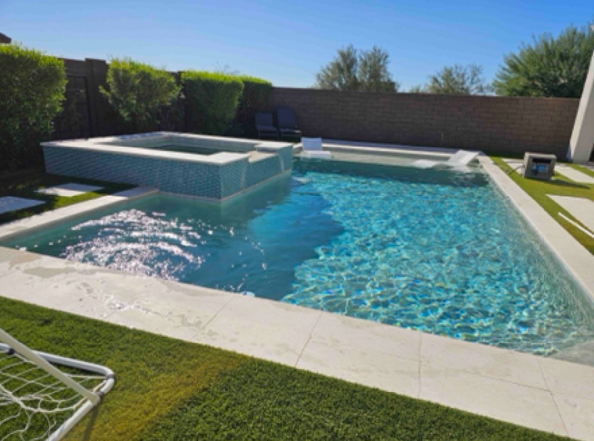Clean modern pool and raised spa maintained by Allen's Pool Catering